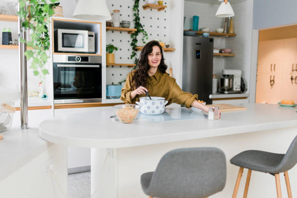 istock Woman cooking at her kitchen 1497361360