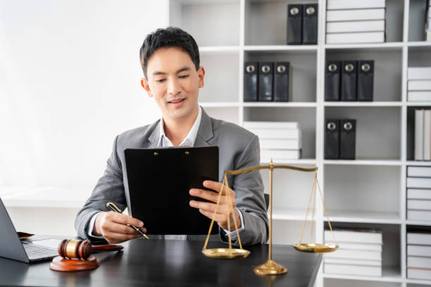 istock Lawyer working on a monograph in courtroom. 1497365054