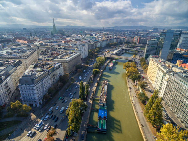 Vienna, Austria - October 07, 2016: Danube River in Vienna, Austria. Ferry, Cityscape in Background.