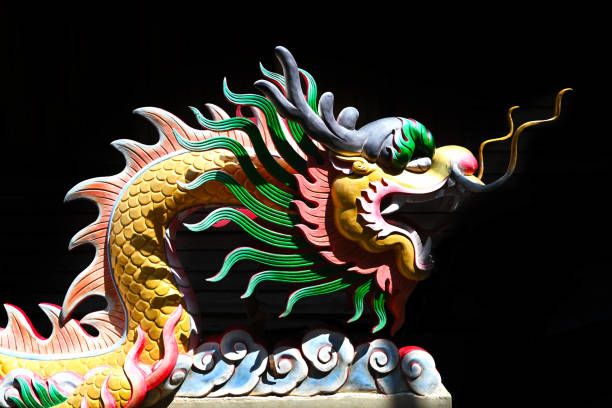 istock colorful dragon statue on black background 1497380908