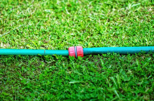 Plastic connection of hoses with water, in the garden