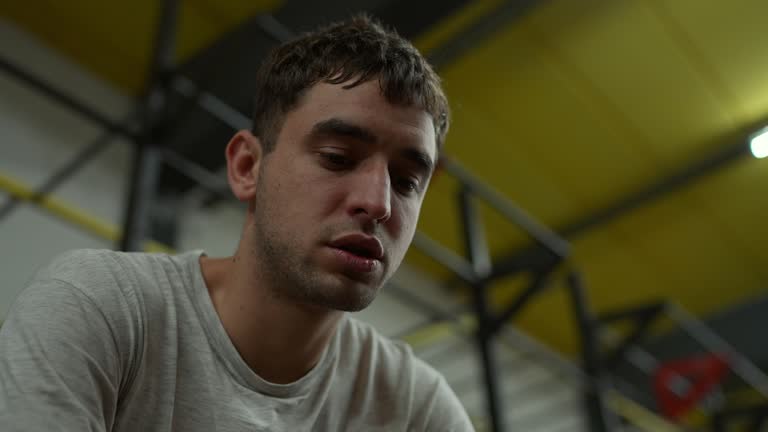 Young man tired after training at the gym