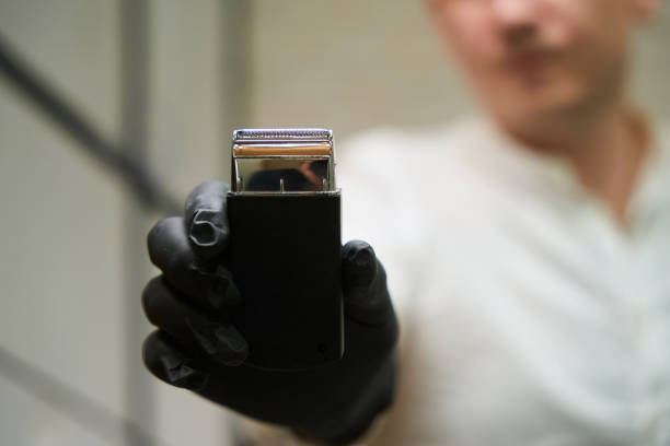 istock Barber man holding a clipper in his hands 1497402533