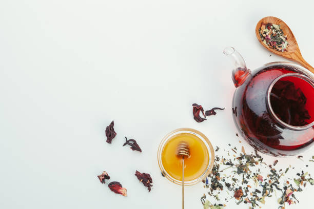 istock A cup with tea and teapot stand on table top view 1497404934