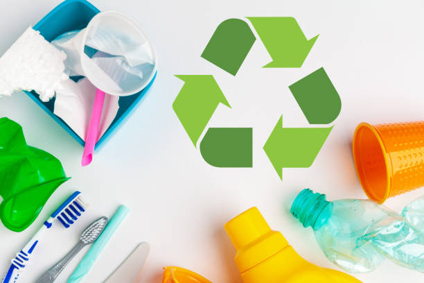 istock waste recycling eco symbol with garbage disposal on table background top 1497405917
