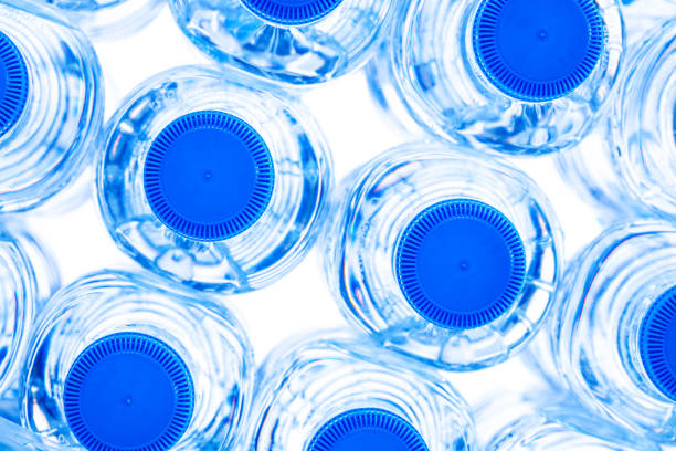 istock group of small plastic water bottles with blue cap. 1497406268