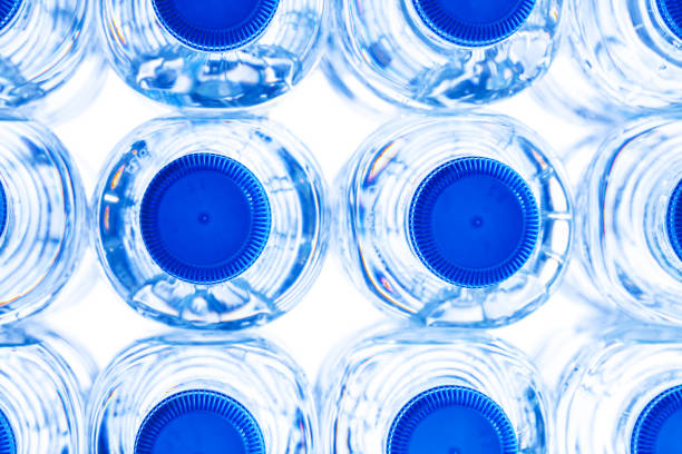 istock group of small plastic water bottles with blue cap. 1497406270