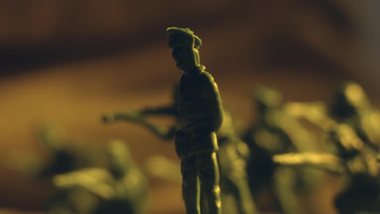 Detailed extreme close up macro shoot of plastic toy soldiers set with deadly weapons ready to battle