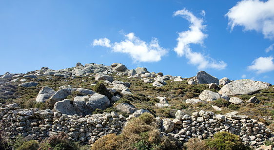 Extraterrestrial landscape huge granite volcanic rock. Volax village in Tinos island, Cyclades Greece. Summer sunny day, blue sky background.