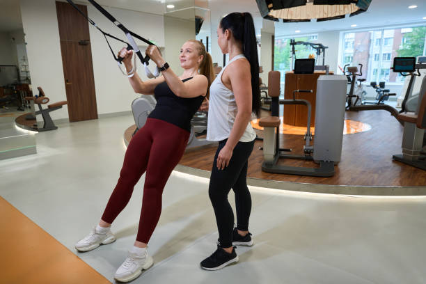 istock Strong young woman is engaged in a modern simulator 1497414926