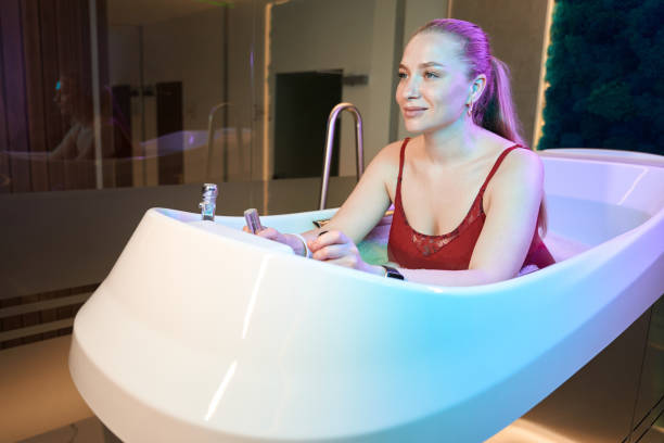 istock Smiling female enjoying efficient treatment on aquabike 1497415056