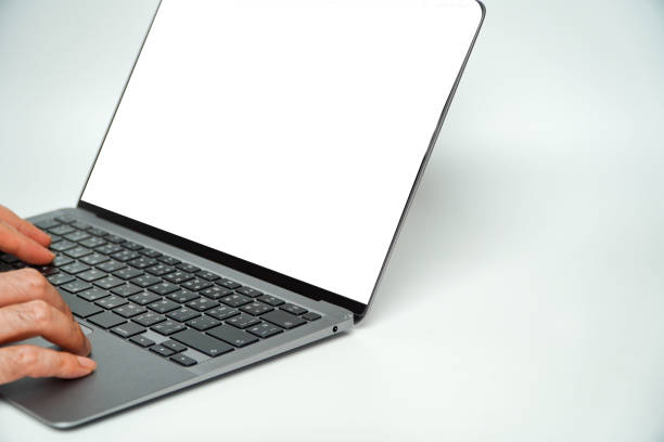 istock Computer mockup blank screenshot with white background for advertising, Mockup image of hand typing on laptop with blank white screen 1497415712