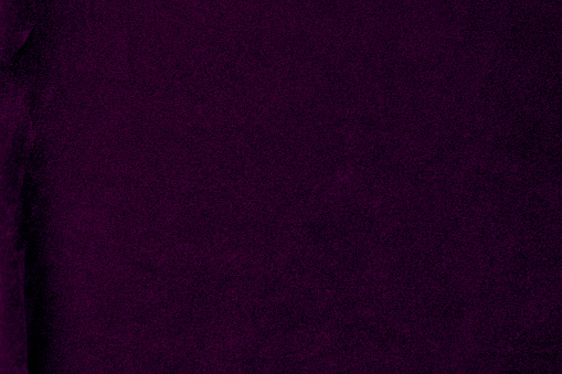 Purple velvet fabric texture used as background. violet fabric background of soft and smooth textile material. There is space for text.