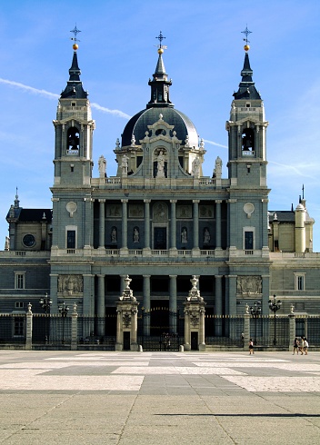 A picturesque church featuring multiple towers with statues of people adorning the exterior