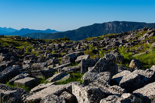 In Mediterranean vegetation mountains view with ancient stones.