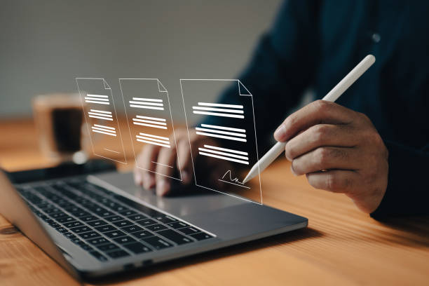 istock The paperless workplace idea includes e-signing, electronic signature, and document management. A businessman uses a stylus pen to sign an electronic document on a virtual notebook screen 1497425907