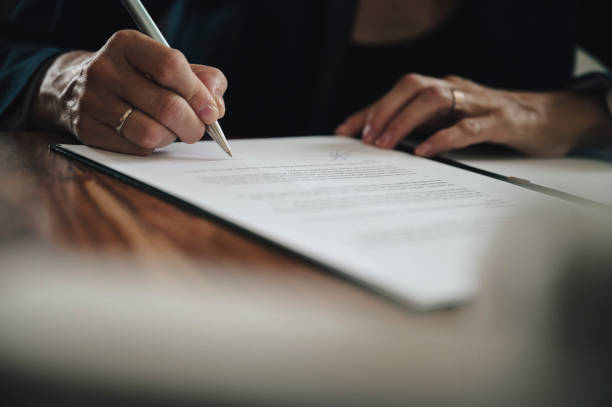 istock Businesswoman signing a document 1497431400