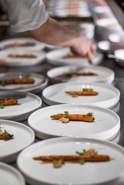 istock Chef prepares a minimal salad plate made with carrots 1497432186