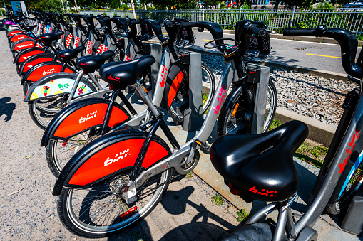 Montreal, Canada - August 29, 2022: many bikes in a row at a bike rental station in Montreal