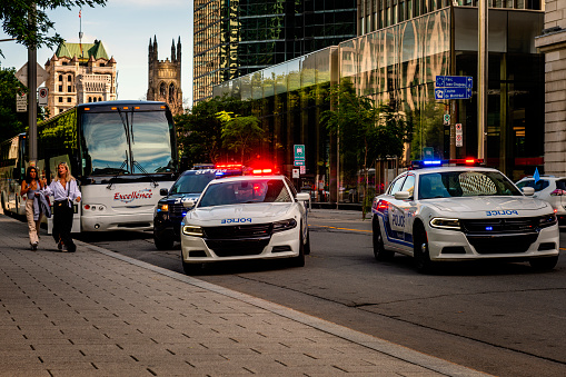 Montreal, Canada - August 28, 2022: Some police cars during an operation in downtown Montreal