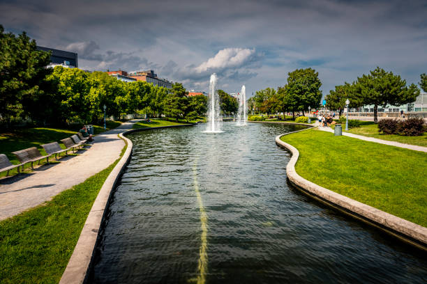 Locals and tourists gather along the bank of Sager Creek as it runs through the middle of Siloam Springs, Arkansas. This was shot June 1, 2024.