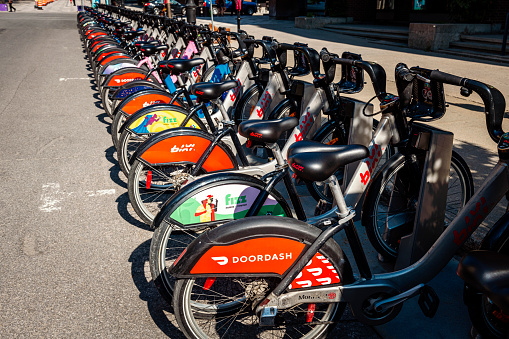 Montreal, Canada - August 29, 2022: many bikes in a row at a bike rental station in Montreal