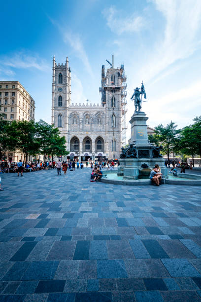 Place d'Armes with Notre-Dame Cathedral in Montreal Montreal, Canada - August 29, 2022: Many people are at Place d'Armes with Notre-Dame Cathedral in Montreal place darmes montreal stock pictures, royalty-free photos & images