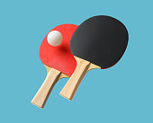 Pair of table tennis paddle and ball isolated on a blue background