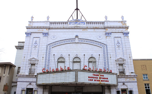 A beautiful white theater building in Paducah, Kentucky with blue accents