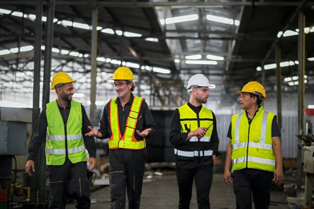 istock Engineers and technicians and workers, working together as a team, walking like an executive inside an industrial warehouse. 1497439265