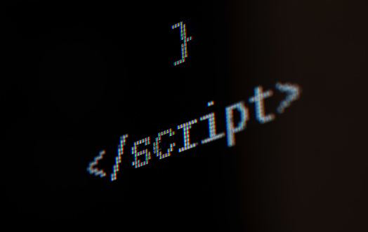 Script inscription on the computer screen.