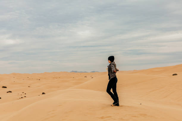 istock Woman dances on sand dunes 1497441955
