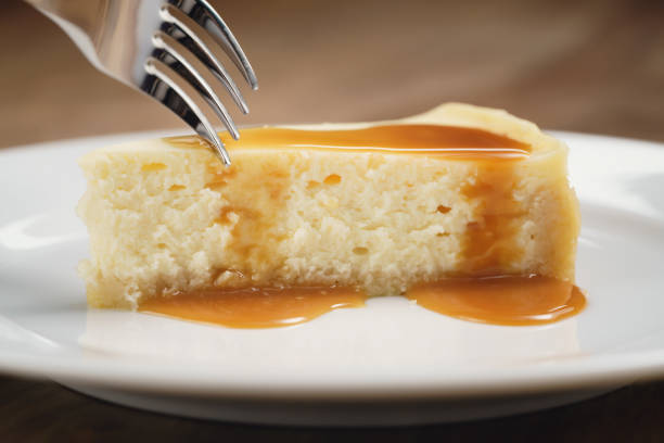 istock cheesecake with caramel sauce on plate closeup eaten with fork 1497442557