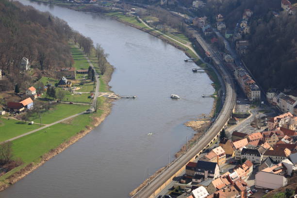 Extreme river flooding from a powerful storm destroying a house completely. Water destroying lives and everything in its way. Endless water damage in Slovenia, 2023. Aerial view of floods.