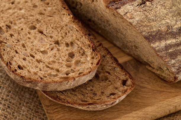 istock Rye bread sliced on wooden table close-up 1497443963