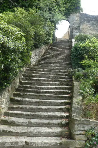 this village of Bonnieux has a double rampart. this staircase leads into the village. photo taken in May. Vaucluse department, Luberon region