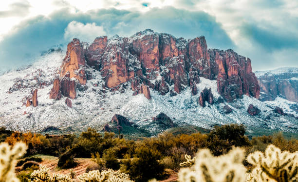 istock Fresh snow fall on mountains in early morning light 1497448145