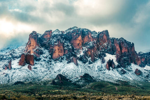 istock Fresh snow fall on mountains in early morning light 1497448326