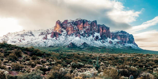 istock Fresh snow fall on mountains in early morning light 1497448328