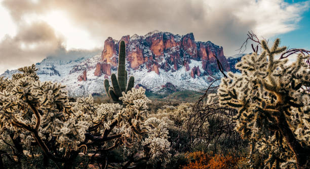 istock Fresh snow fall on mountains in early morning light 1497448448