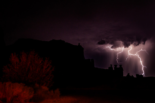 A nocturnal storm with lightning and thunder to light up the night. Arches National Park Utah. The park has over 2,000 natural stone arches, hundreds of soaring pinnacles, massive rock fins, and giant balanced rocks. Arches National Park Utah