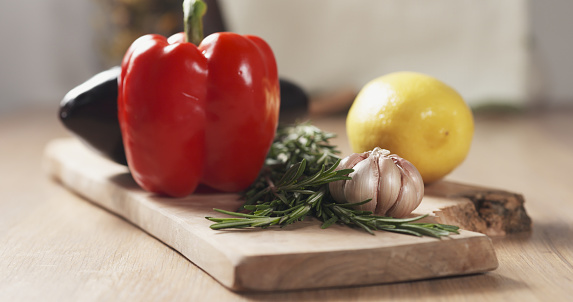 fresh vegetables, eggplant, bell pepper, lemon, garlic and rosemary wide photo