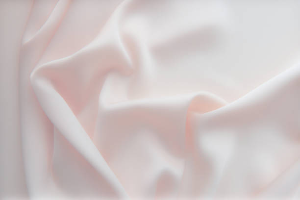 istock Smooth elegant silk or satin luxury cloth texture can use as wedding background. Luxurious background design. In light pink toned. Retro style. Soft fokus. 1497461437