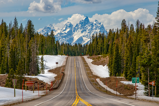 Highway view of the Teton peaks approaching from Dubois, Wyoming in western USA, North America.