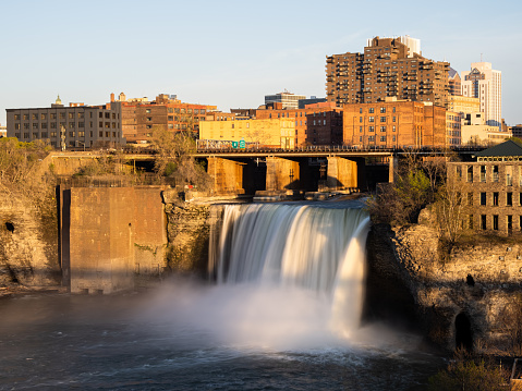 Silky, smooth water and golden sunset at High Falls in Rochester, Upstate New York State.