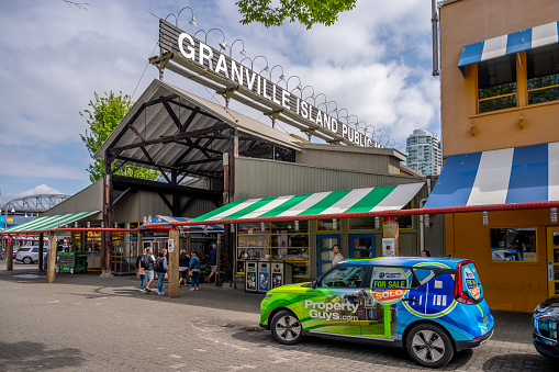Vancouver, British Columbia - May 27, 2023: Views of Vancouver's landmark attraction - Granville Island Public Market, restaurants, and shops.