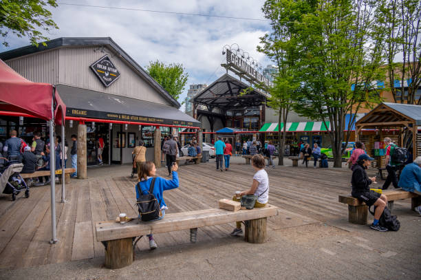 Granville Island Market, Vancouver Vancouver, British Columbia - May 27, 2023: Views of Vancouver's landmark attraction - Granville Island Public Market, restaurants, and shops. granville island stock pictures, royalty-free photos & images