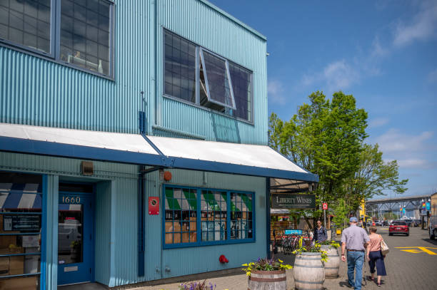 Granville Island Market, Vancouver Vancouver, British Columbia - May 27, 2023: Views of Vancouver's landmark attraction - Granville Island Public Market, restaurants, and shops. granville island stock pictures, royalty-free photos & images