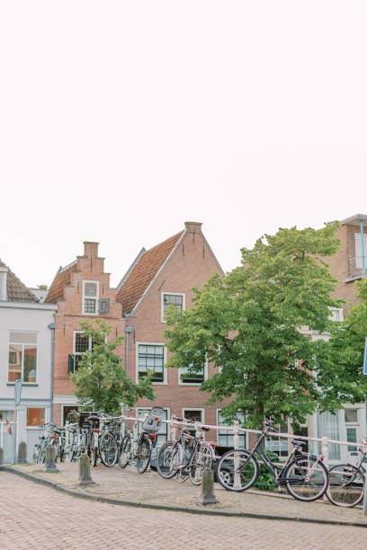 istock Several bicycles are leaning against a bridge over a smal 1497473055
