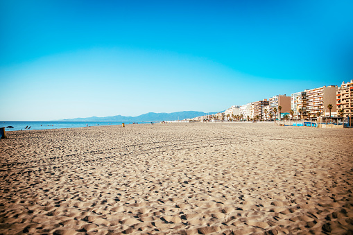 Beautiful wide Sand Beach on French Riviera. City public beach in Canet-en-Roussillon. Copy space